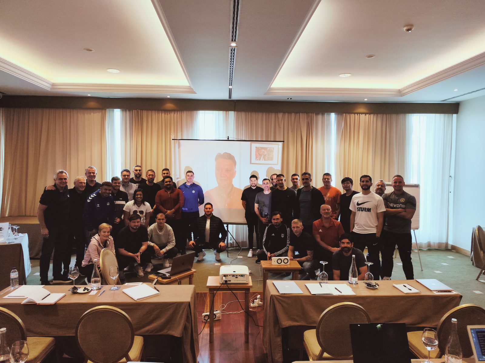 Group of coaches at a Sportrail coaching seminar in a Lisbon conference venue