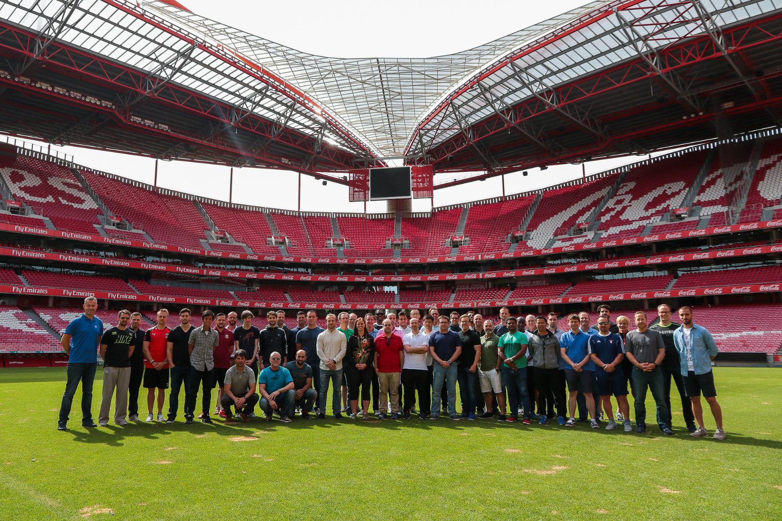 Group of coaches on the pitch at Estádio da Luz, Lisbon, during a Sportrail bespoke club experience